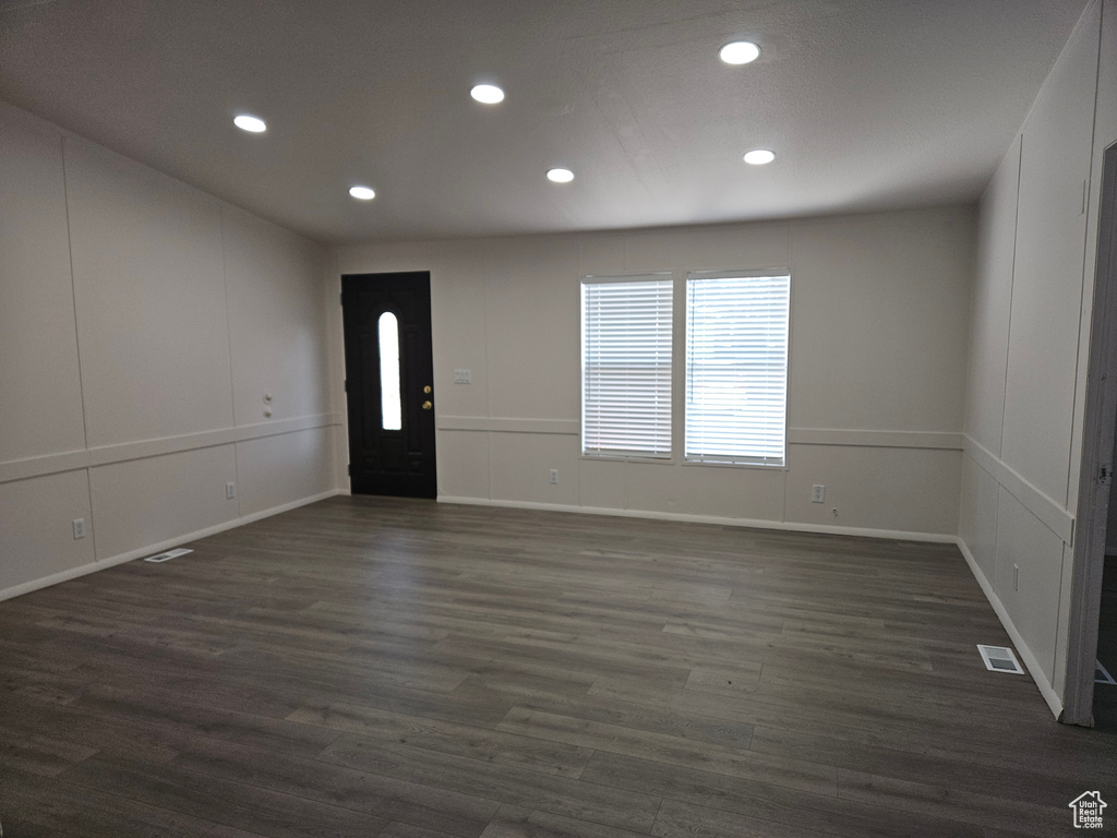 Entryway with dark hardwood / wood-style floors