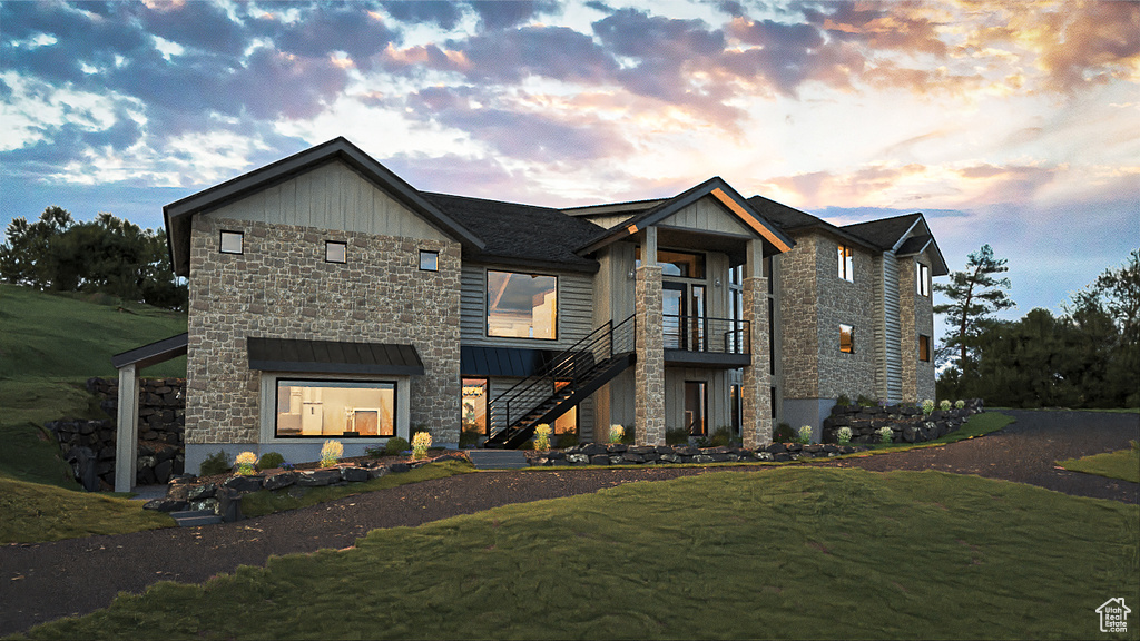 View of front of property with a lawn