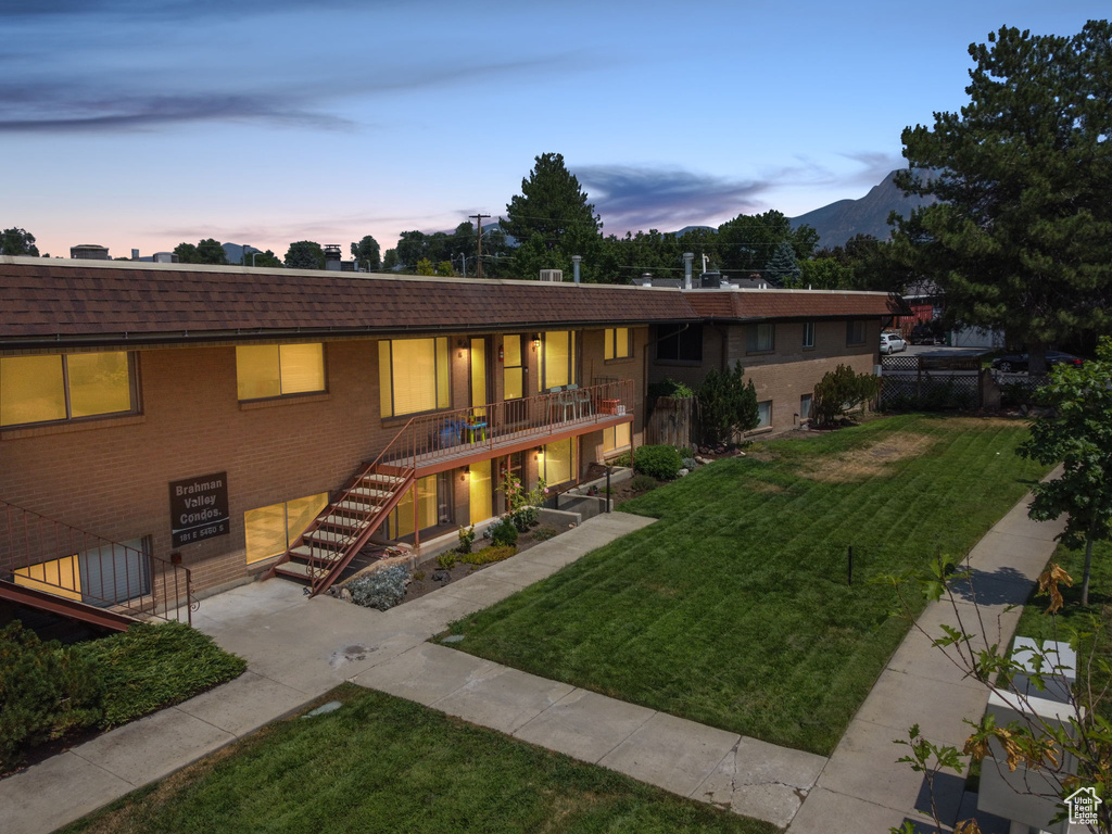 View of front of home featuring a lawn