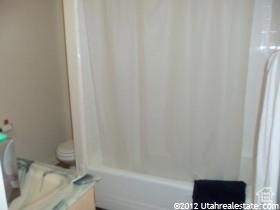 Full bathroom featuring vanity, shower / washtub combination, and toilet