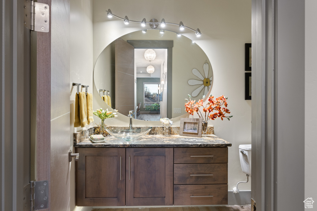 Bathroom featuring vanity and toilet