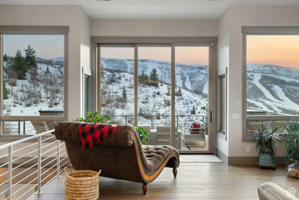 Sunroom / solarium with plenty of natural light and a mountain view