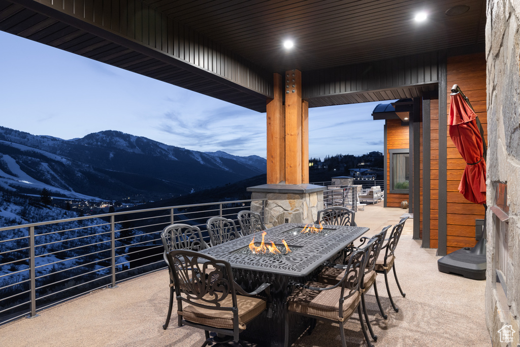 View of patio / terrace with a mountain view and outdoor dining space