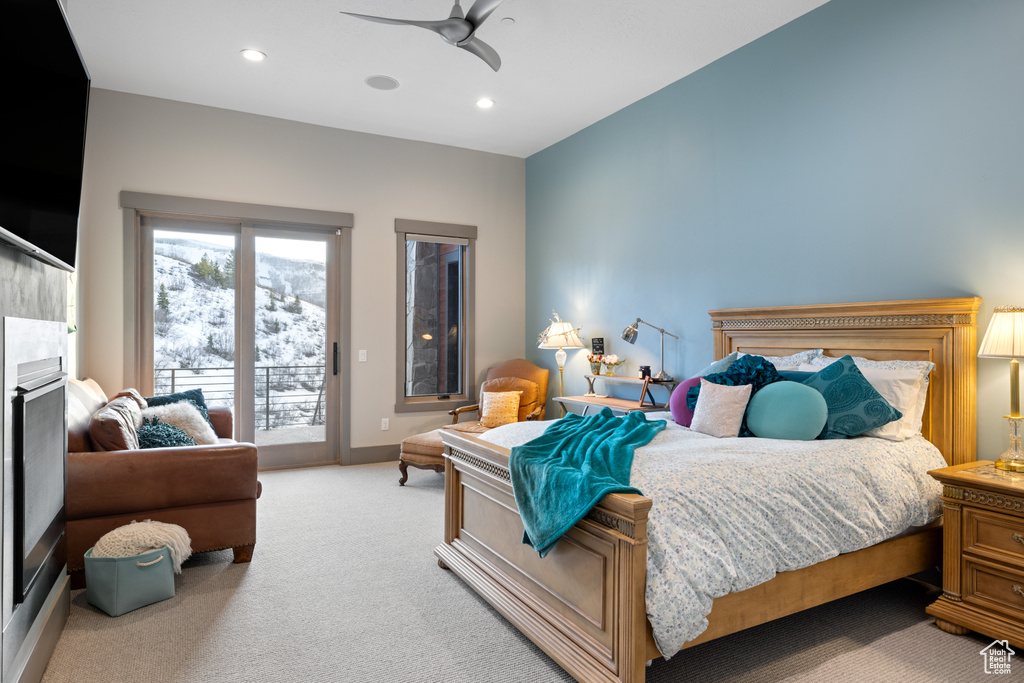 Bedroom with baseboards, a ceiling fan, recessed lighting, access to exterior, and light colored carpet