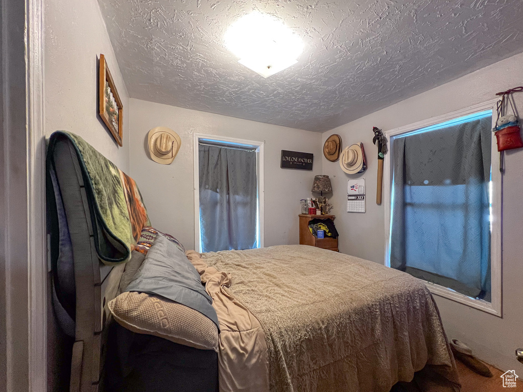 Bedroom featuring a textured ceiling