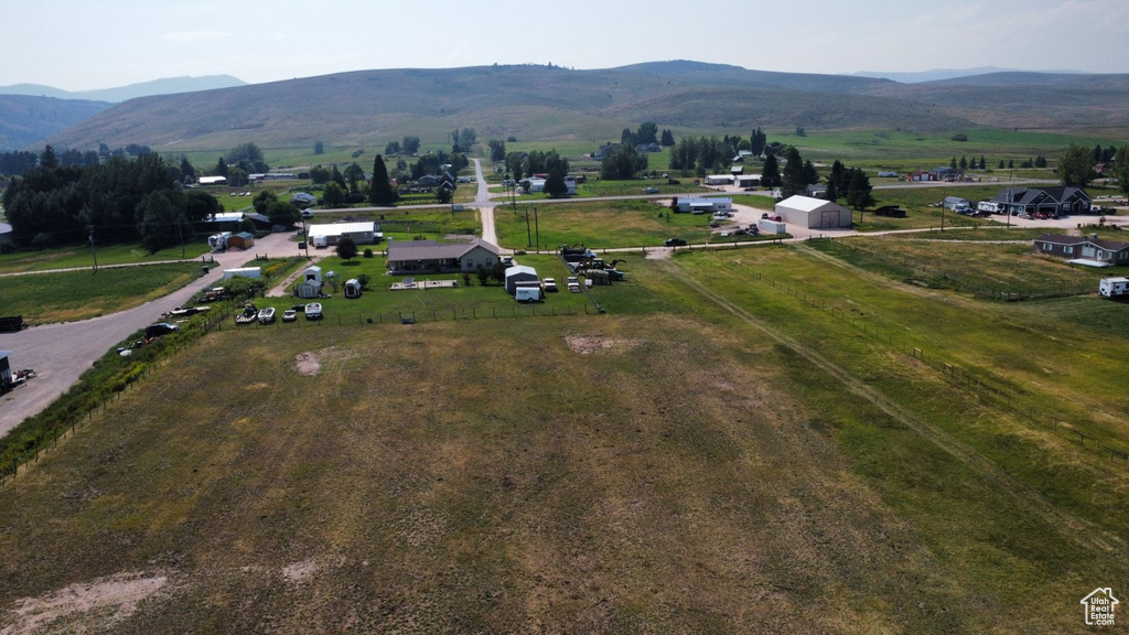 Birds eye view of property with a mountain view and a rural view