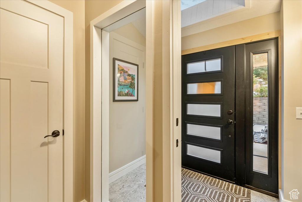 Entryway featuring light tile patterned floors