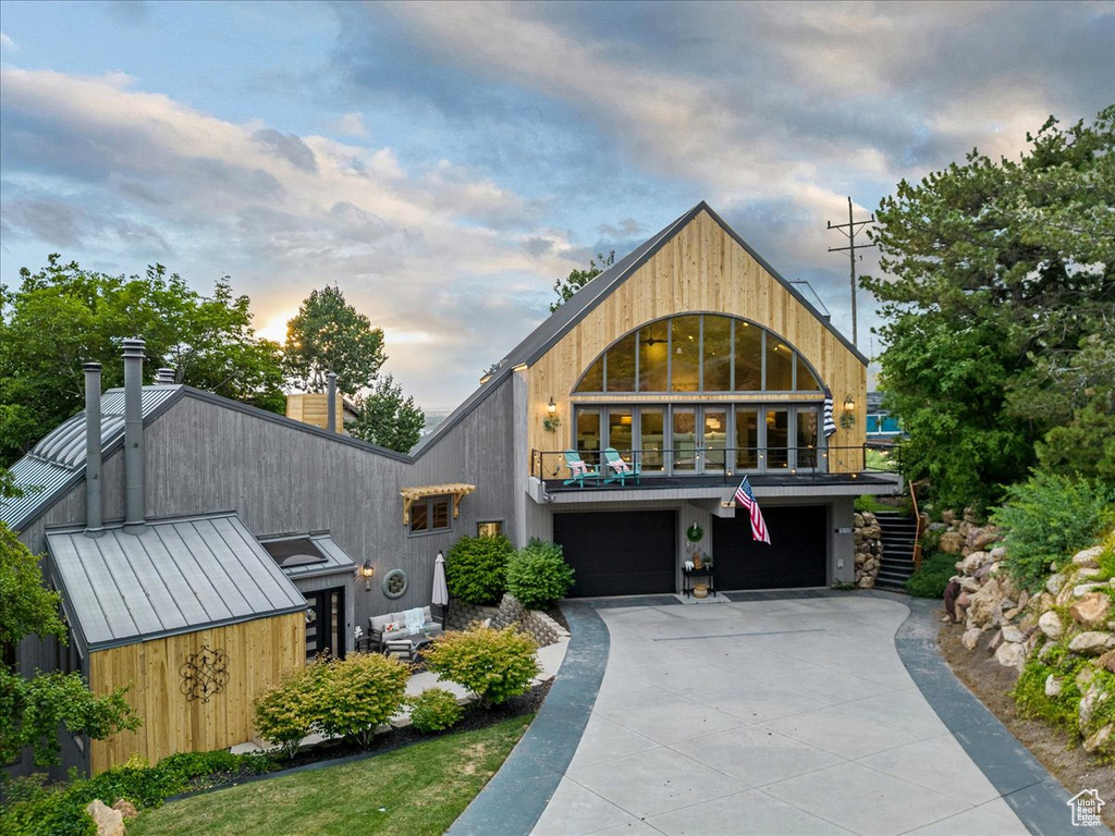 View of front facade featuring a garage