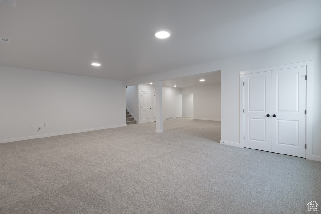 Basement with light carpet