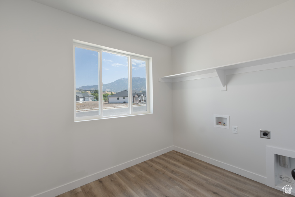 Laundry area featuring a mountain view, electric dryer hookup, wood-type flooring, and hookup for a washing machine