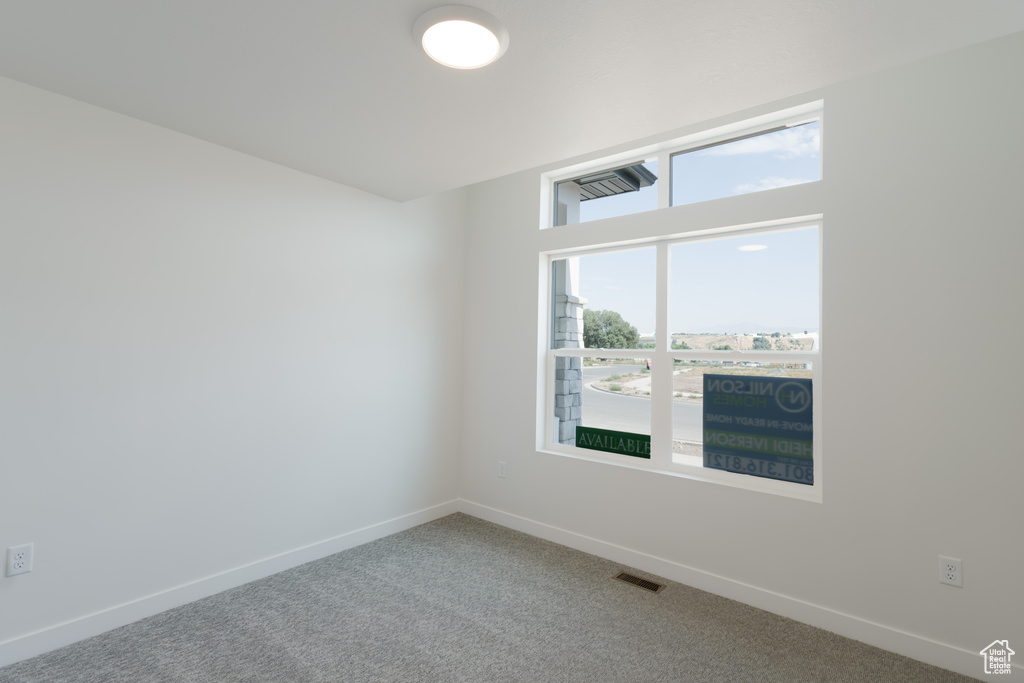 View of carpeted spare room