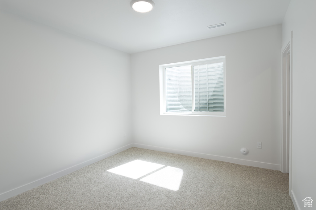 Empty room featuring carpet flooring