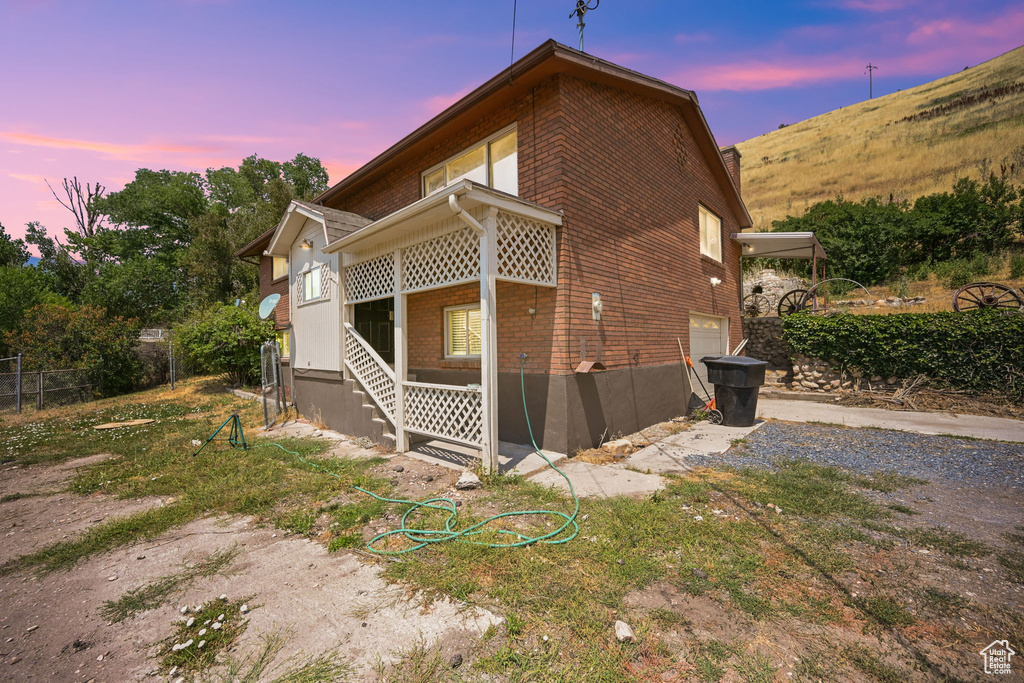 View of property exterior at dusk