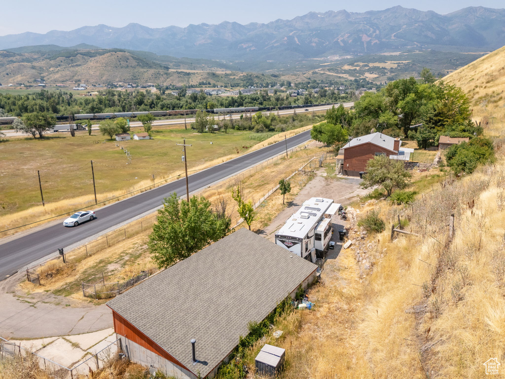 Birds eye view of property with a mountain view