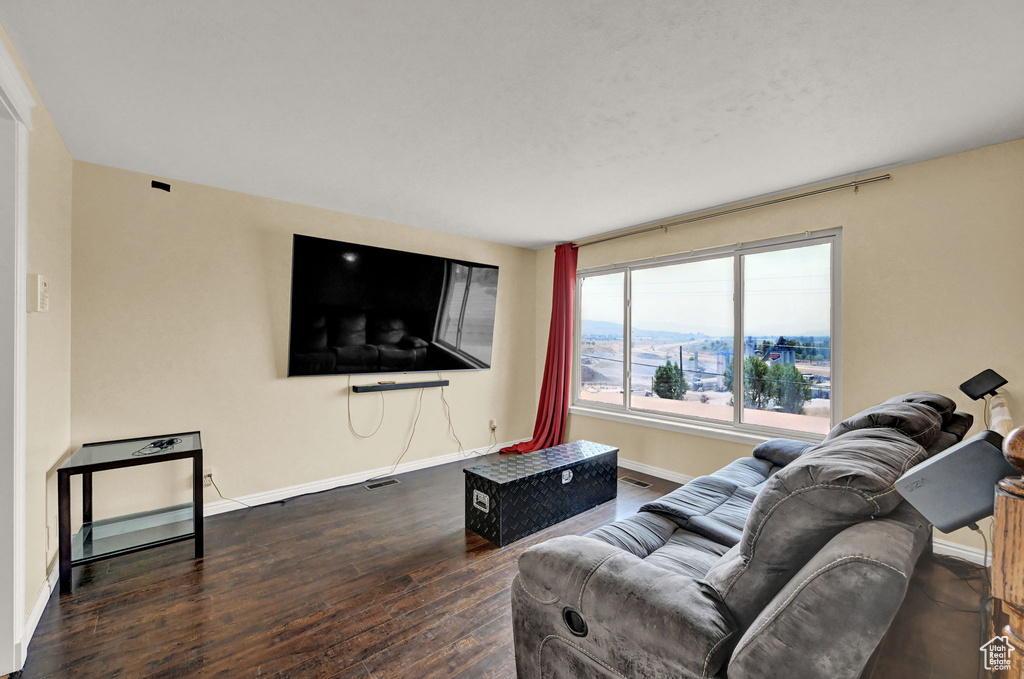 Living room with wood-type flooring