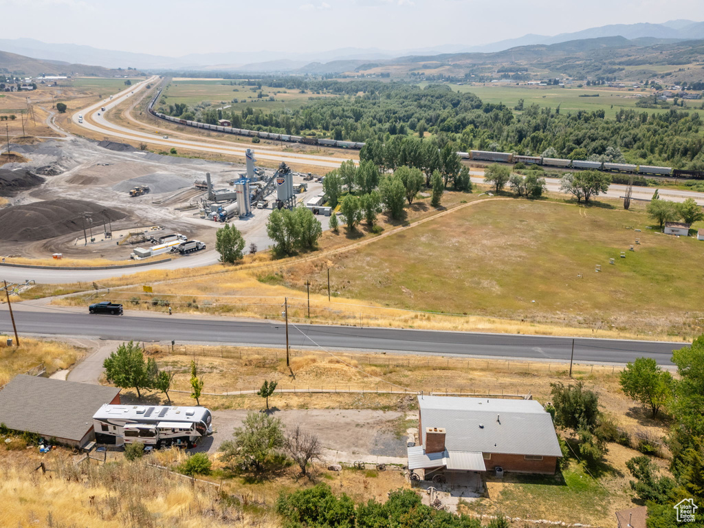 Birds eye view of property with a mountain view and a rural view