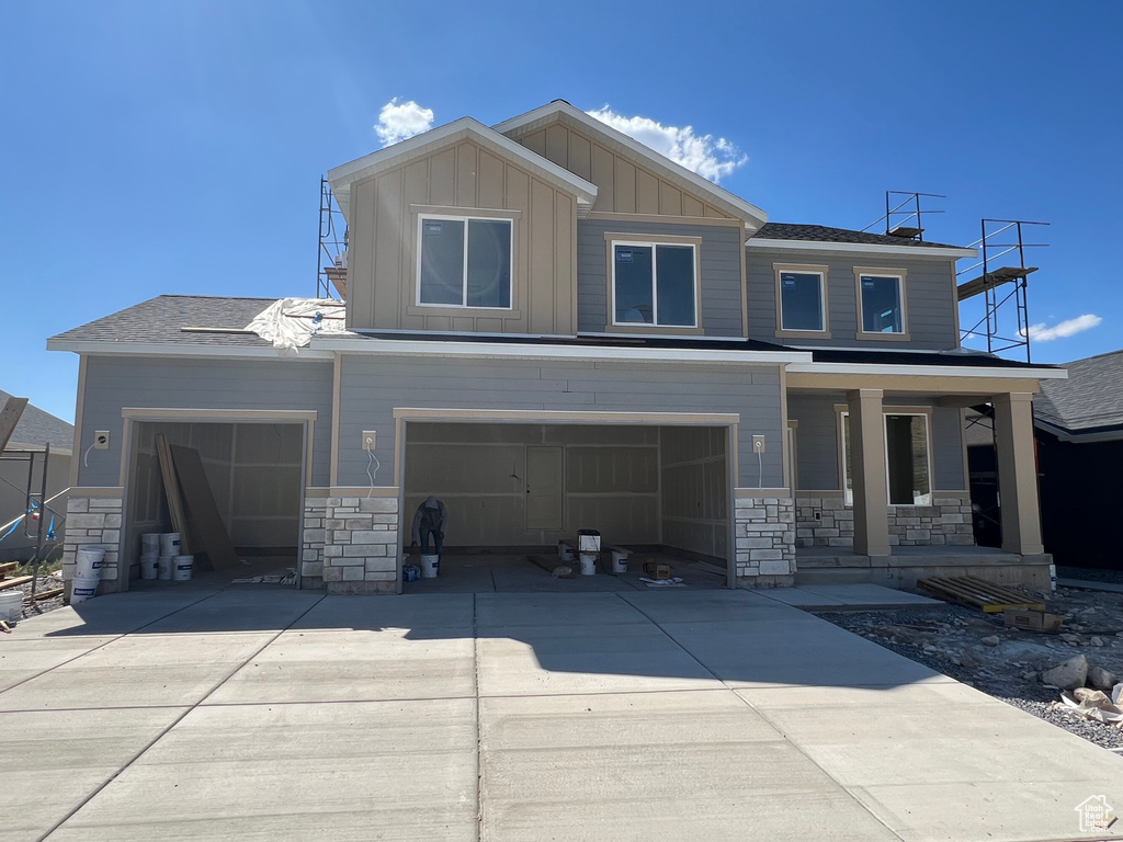 Craftsman-style home featuring covered porch