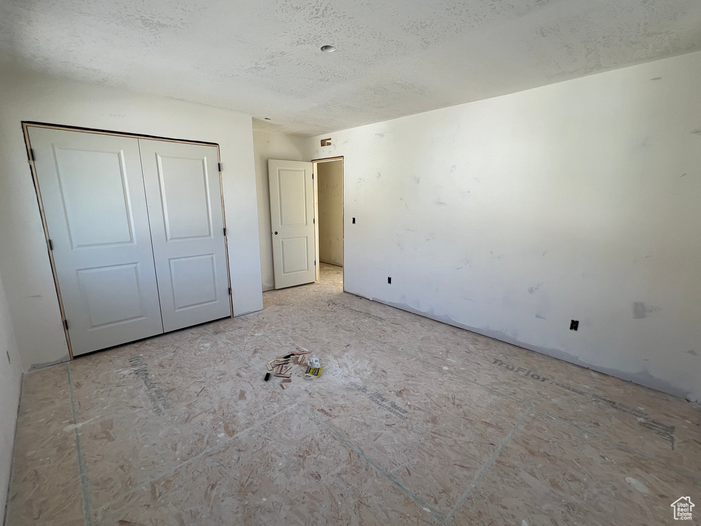 Unfurnished bedroom featuring a closet