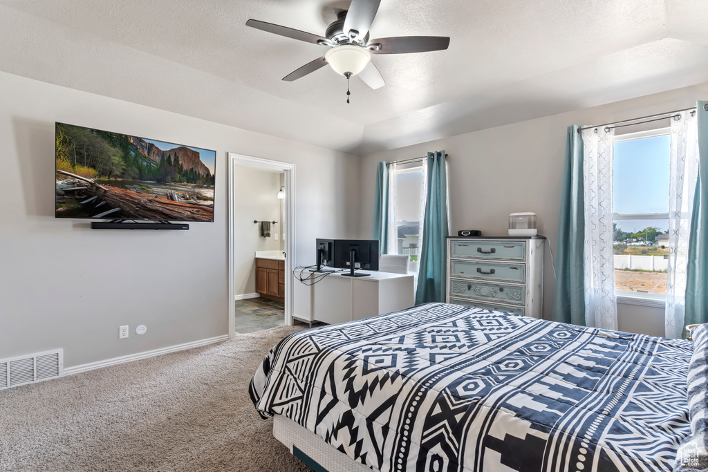 Bedroom featuring carpet flooring, connected bathroom, and ceiling fan