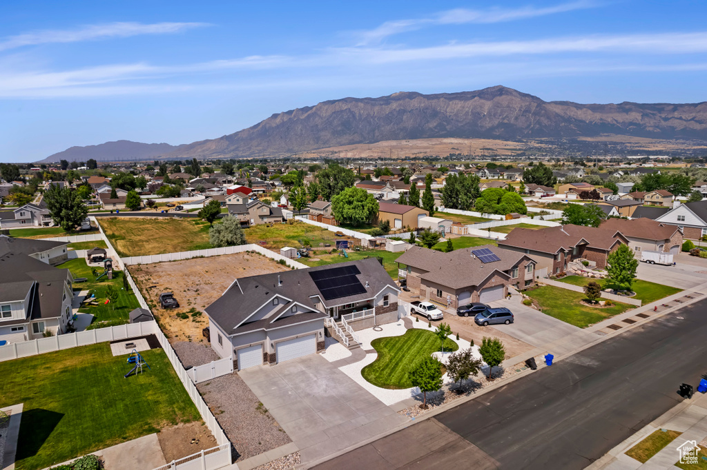 Birds eye view of property with a mountain view