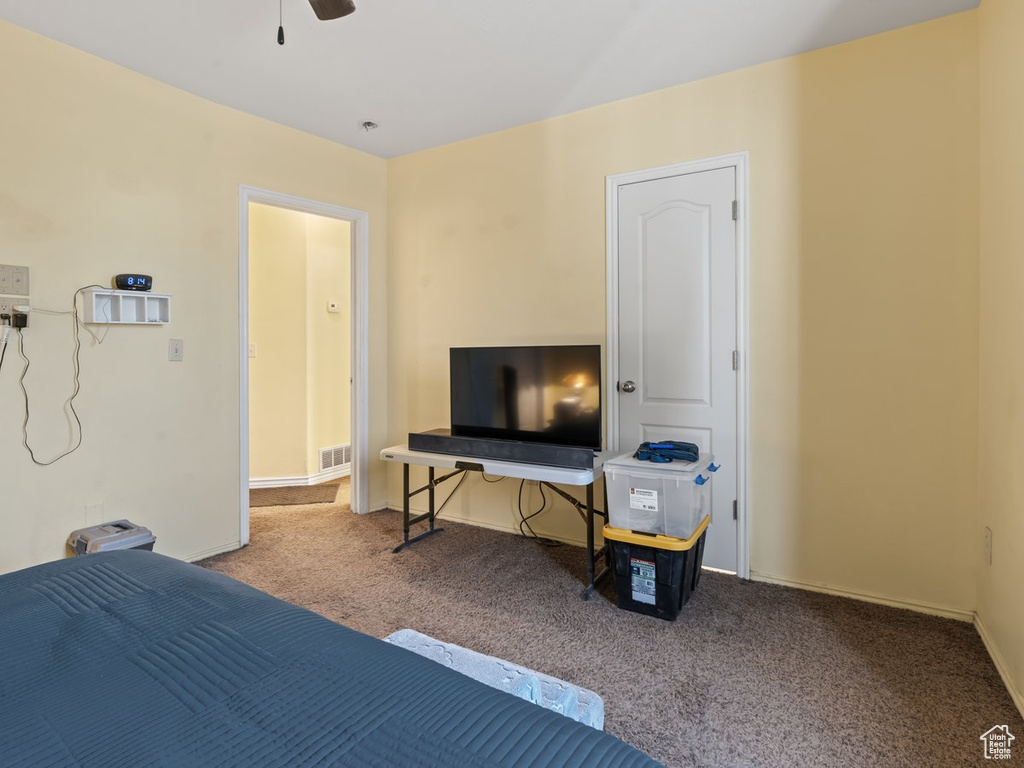 Bedroom with carpet and ceiling fan