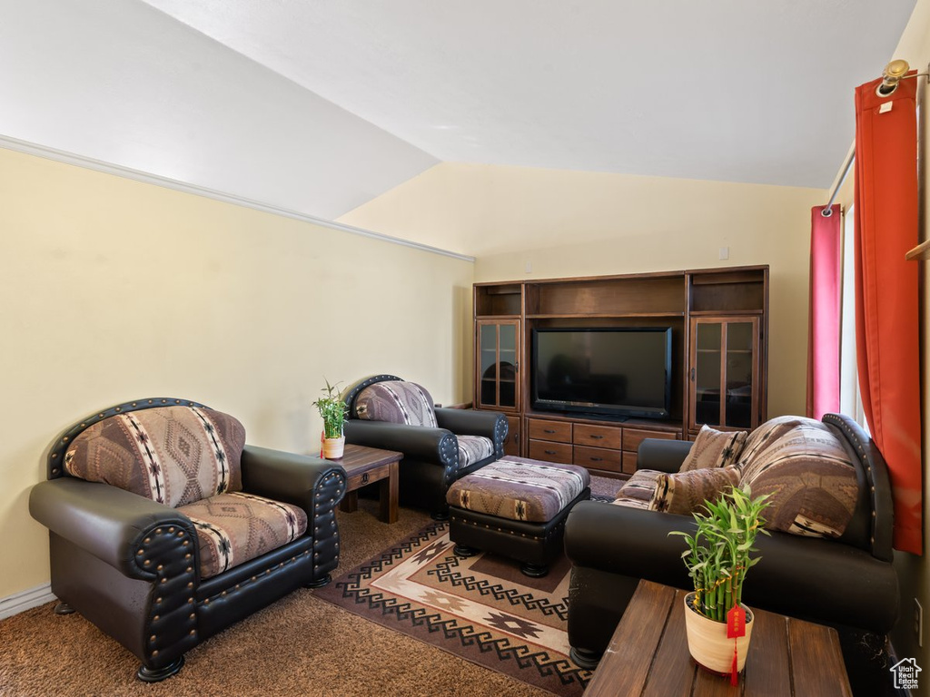 Living room with carpet and lofted ceiling