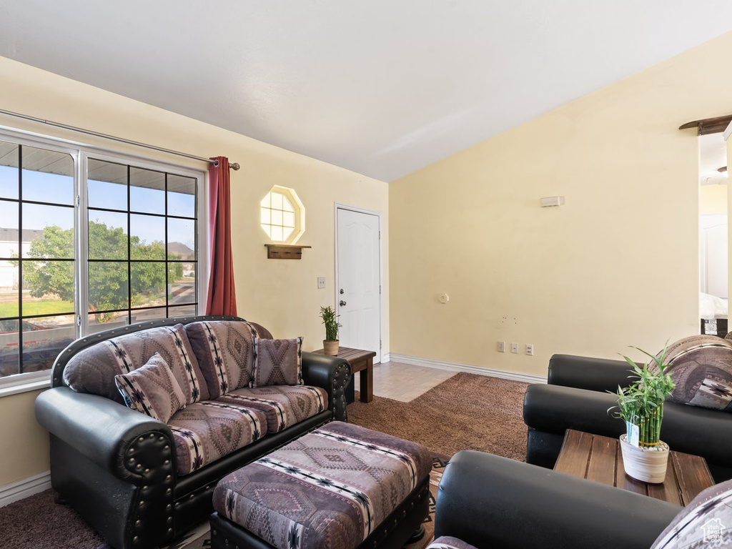 Living room featuring lofted ceiling