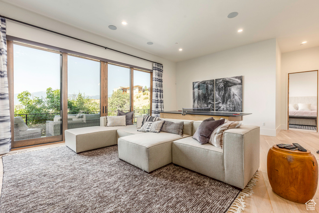 Living room with light hardwood / wood-style flooring