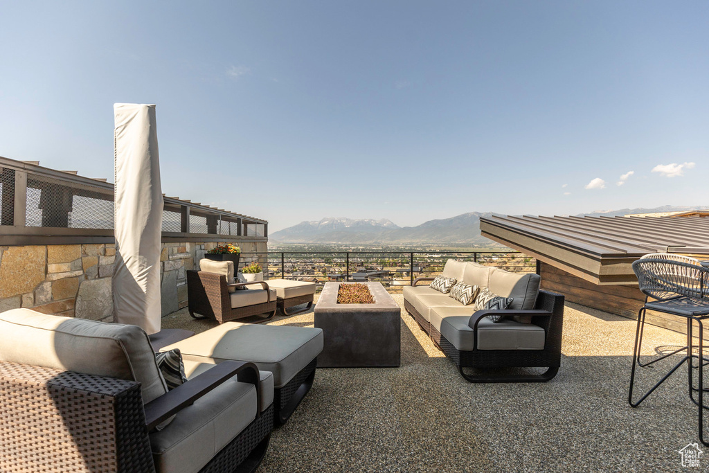 View of patio featuring a mountain view and an outdoor hangout area