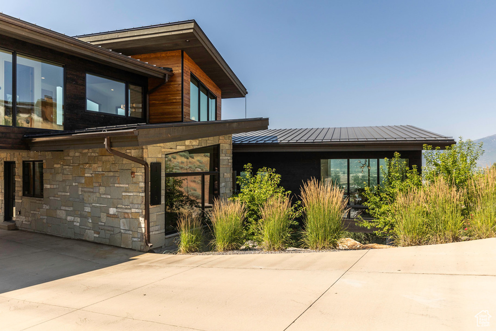 View of side of property with a patio