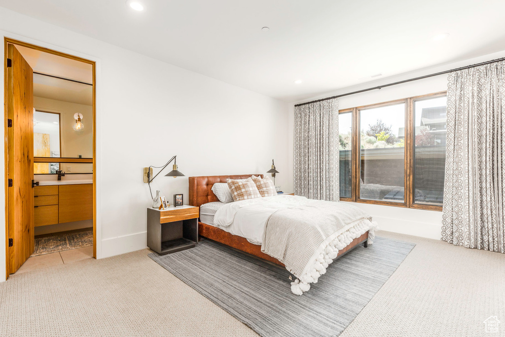 Bedroom with light carpet