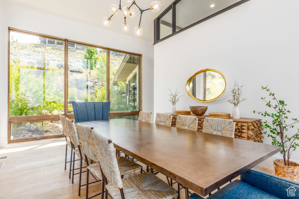 Dining room featuring a notable chandelier and light hardwood / wood-style flooring