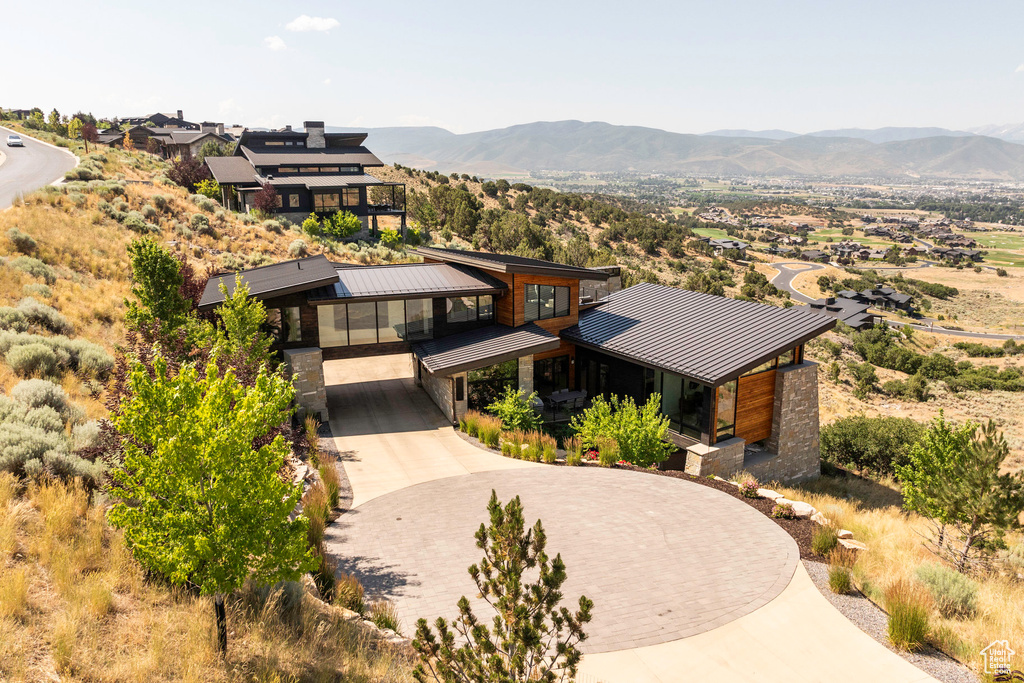 Birds eye view of property with a mountain view