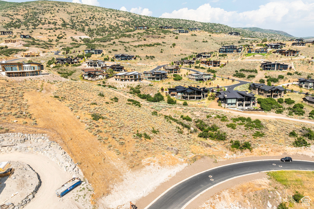 Birds eye view of property with a mountain view