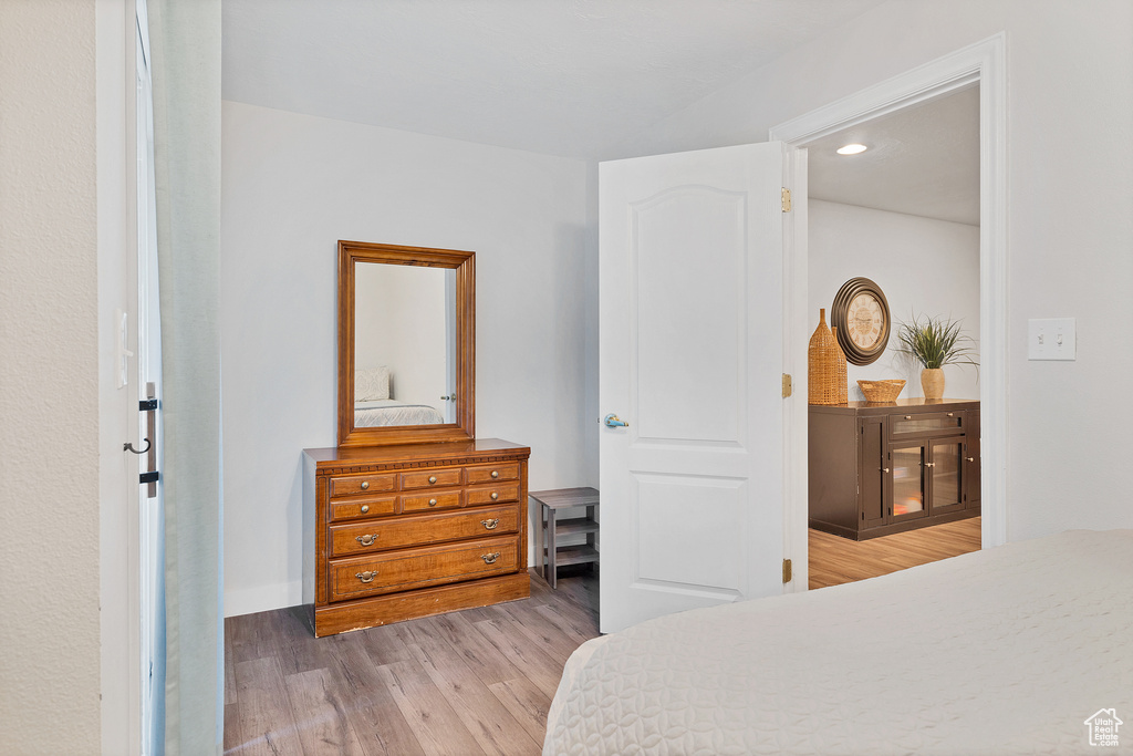 Bedroom with hardwood / wood-style floors