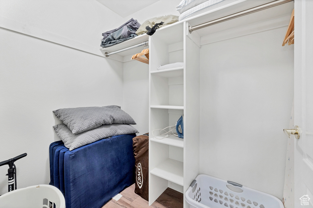 Walk in closet featuring hardwood / wood-style floors