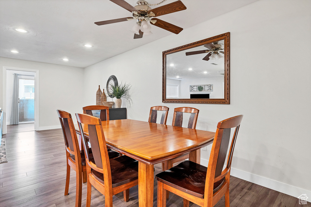 Dining space featuring hardwood / wood-style flooring and ceiling fan