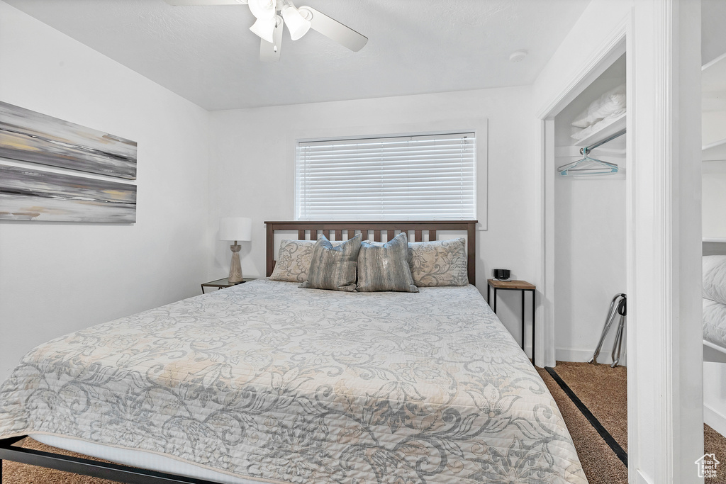 Bedroom featuring carpet and ceiling fan