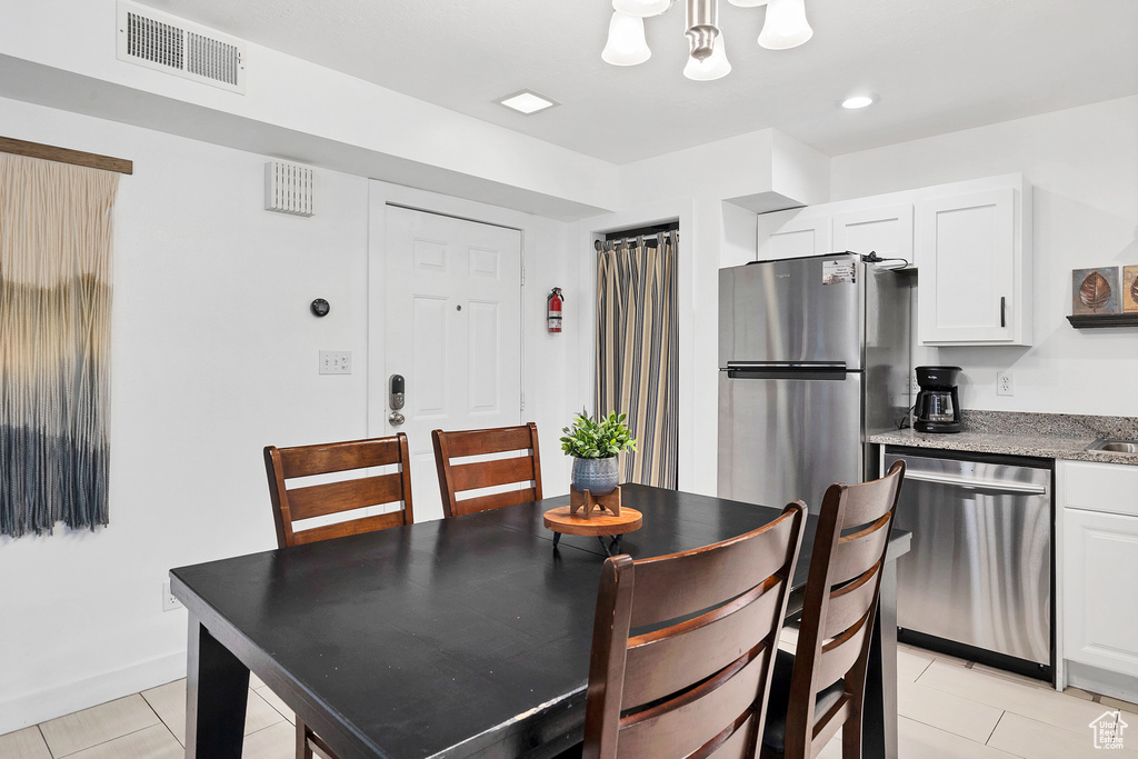 Dining area featuring light tile patterned floors