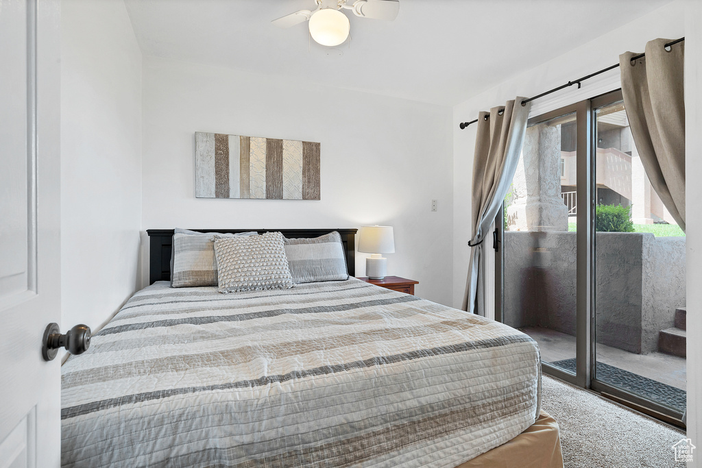 Bedroom with carpet flooring, access to outside, and ceiling fan