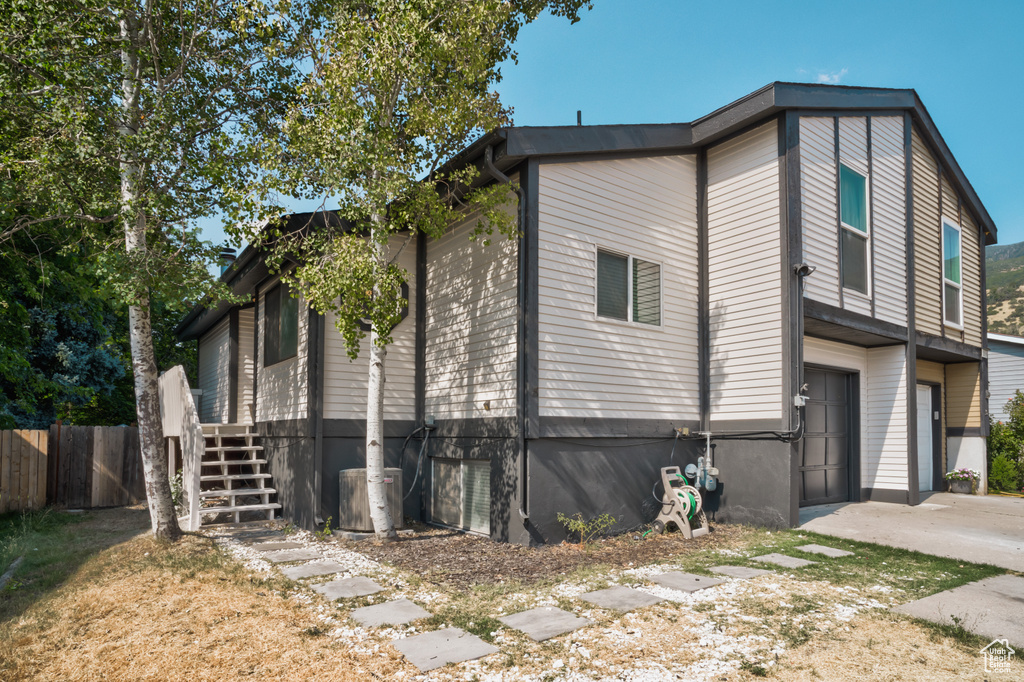 View of side of home featuring a garage