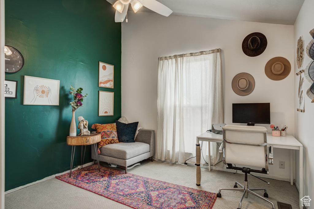 Office space with vaulted ceiling, carpet floors, ceiling fan, and plenty of natural light