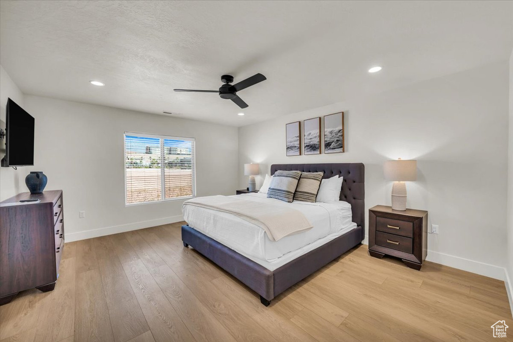 Bedroom featuring ceiling fan and light wood-type flooring