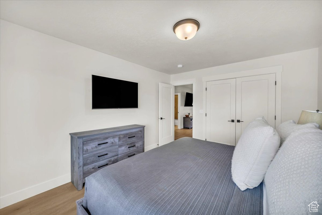 Bedroom featuring a closet and hardwood / wood-style floors