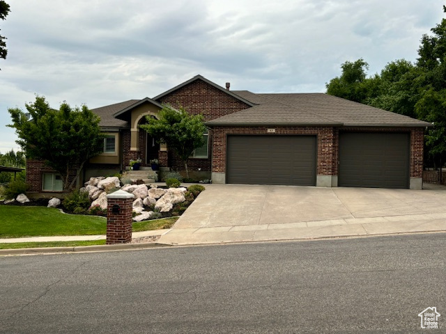 View of front facade featuring a garage