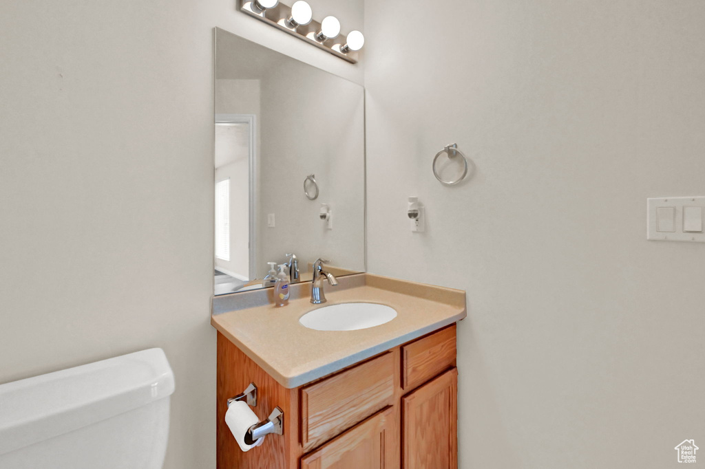 Bathroom featuring vanity and toilet