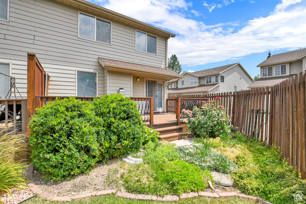 Rear view of property with a wooden deck