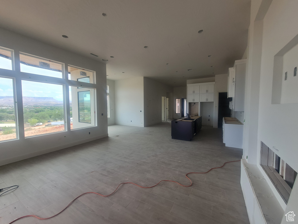 Unfurnished living room with light hardwood / wood-style flooring