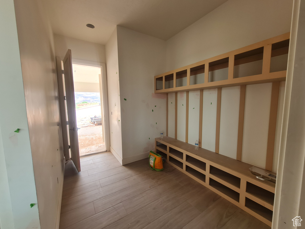 Mudroom with light hardwood / wood-style floors