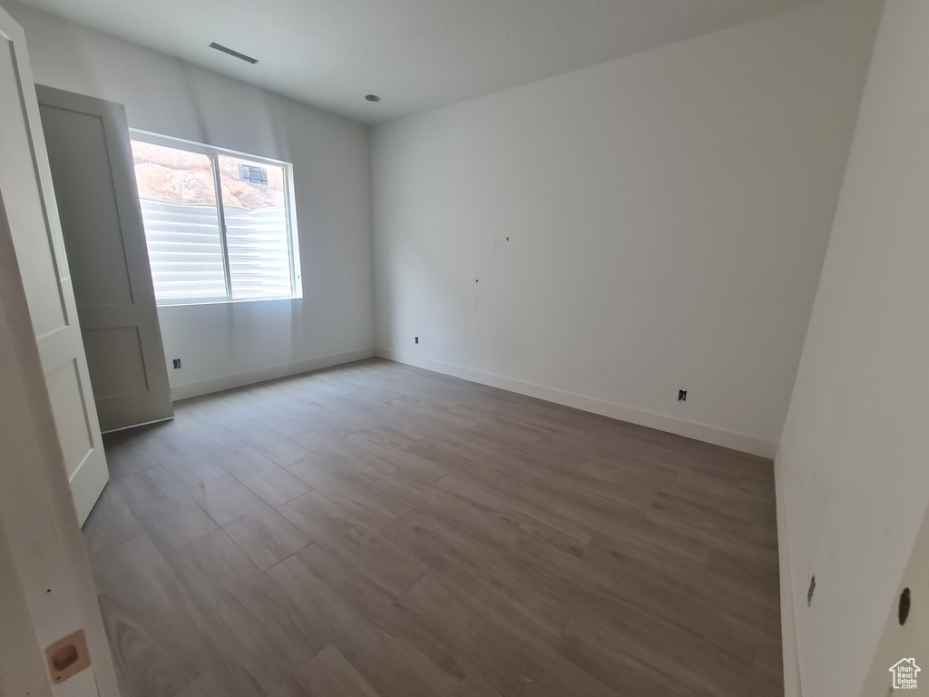 Spare room with hardwood / wood-style flooring